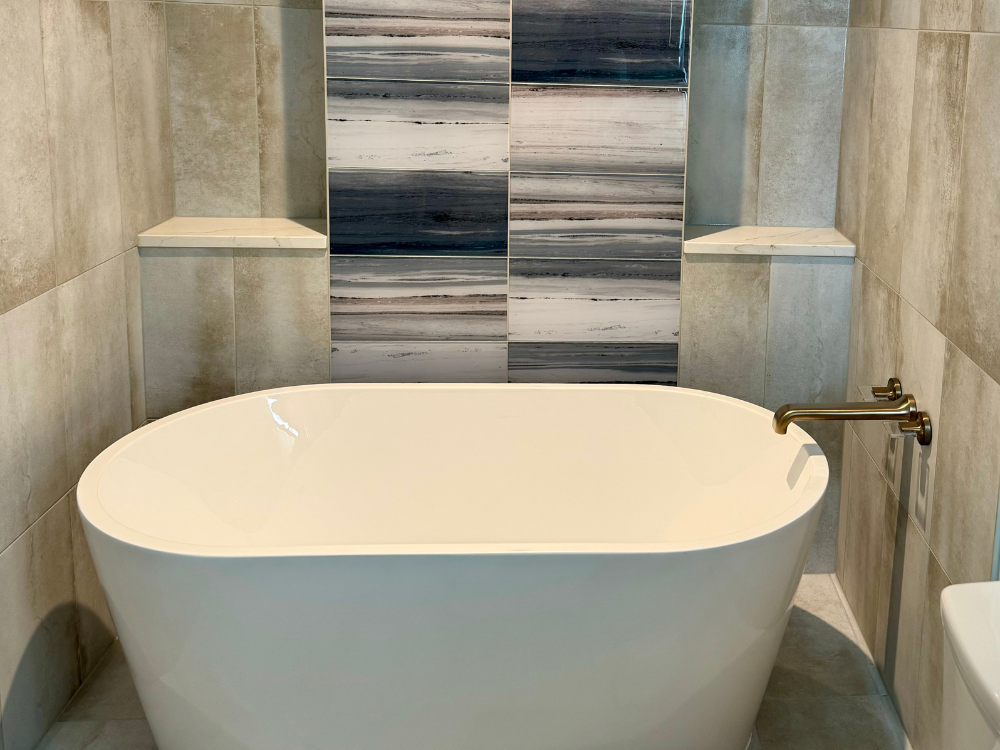 Bathtub surrounded by wall tile